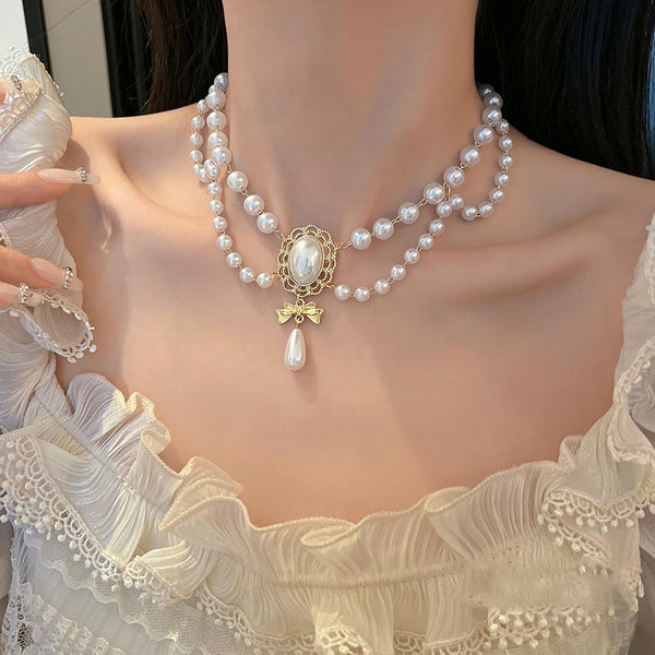Gilded Bow Pearl Necklace