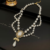 Gilded Bow Pearl Necklace width=100 