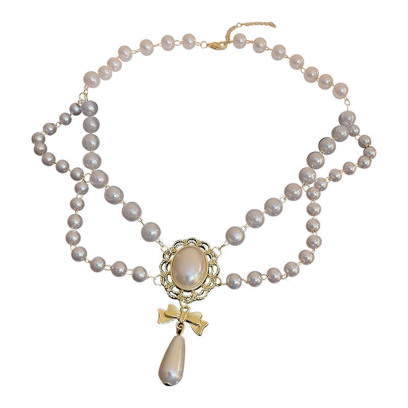 Gilded Bow Pearl Necklace