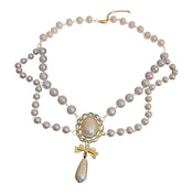Gilded Bow Pearl Necklace width=100 